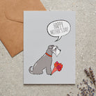 Salt & Pepper Schnauzer Mother's Day card featuring illustrated Grey Schnauzer holding flowers — blank inside with optional handwritten message, perfect gift for dog mums