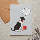 Springer Spaniel Mother's Day card featuring illustrated Black & White Springer Spaniel holding flowers — blank inside with optional handwritten message, perfect gift for dog mums