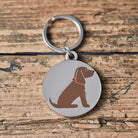 Close-up of Chocolate Cocker Spaniel personalised dog tag — silver-plated brass with illustrated Cocker Spaniel design, personalised dog lover gift by Sweet William Designs