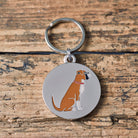 Close-up of Boxer dog ID tag — silver-plated brass with signature Boxer illustration, personalised dog tag by Sweet William Designs