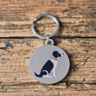 Close-up of Black & White Springer Spaniel dog ID tag — silver-plated brass with illustrated Springer Spaniel design, personalised dog tag by Sweet William Designs