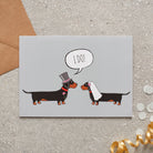 Dachshund wedding card featuring a charming bride and groom with an ‘I DO!’ message, perfect for celebrating a dog-loving couple’s special day