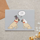 Pug wedding card featuring a charming bride and groom with an ‘I DO!’ message, perfect for celebrating a dog-loving couple’s special day