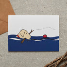 Swimming Yellow Labrador card featuring a water-loving Yellow Lab chasing a ball while holding a stick, with the words “Happiness is a ball and a stick” by Sweet William Designs