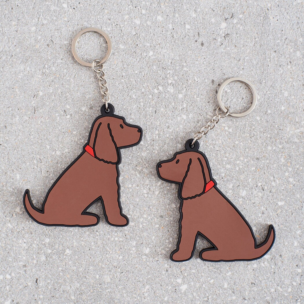 Chocolate Cocker Spaniel keyring showing both sides — double-sided PVC design with Sweet William's classic illustration