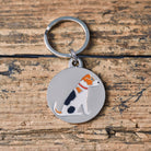 Close-up of Jack Russell dog ID tag — silver-plated brass with illustrated Jack Russell design, personalised dog tag by Sweet William Designs