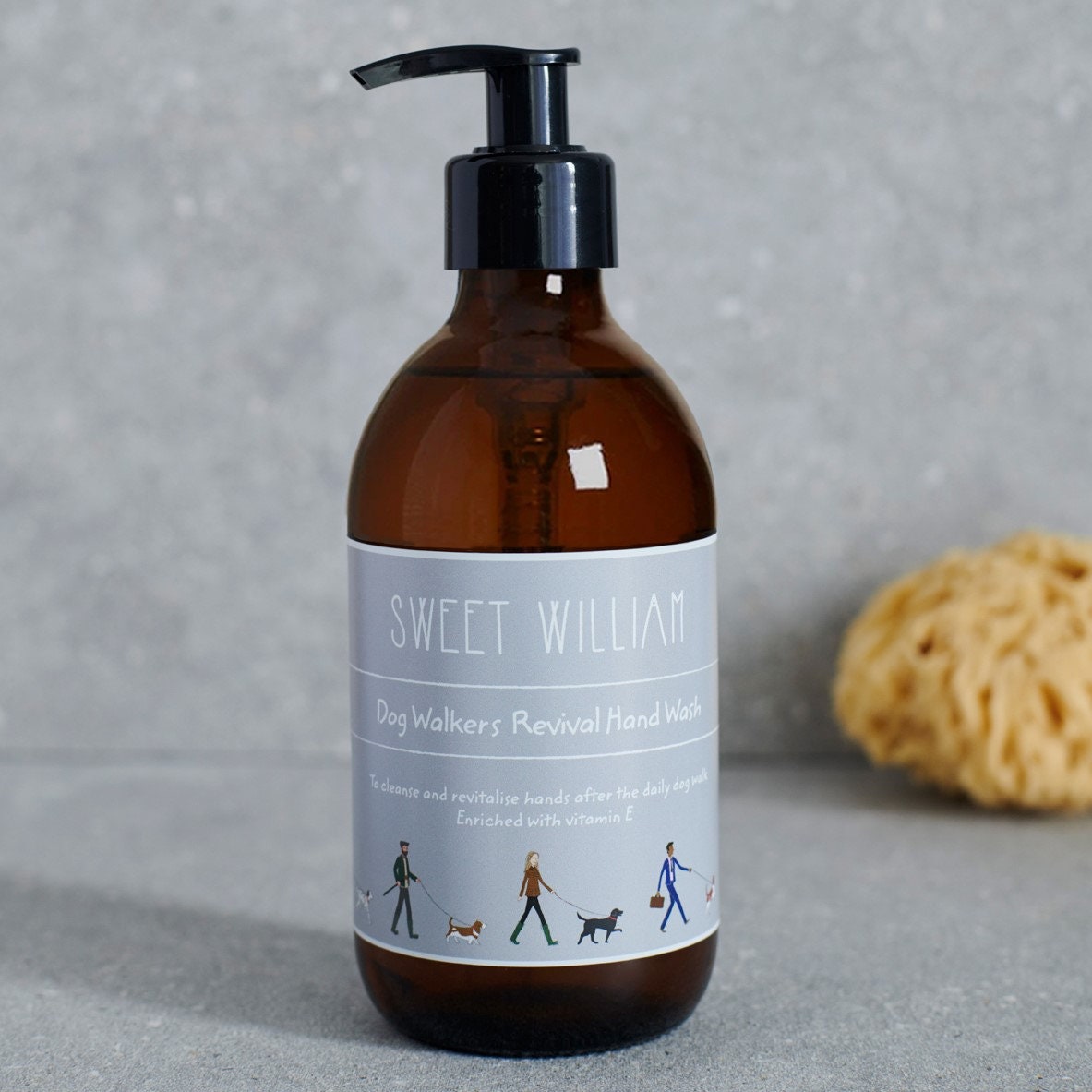 Close-up of Dog Walkers Revival Hand Wash label in amber glass pump bottle — enriched with vitamin E, dog walker gift by Sweet William Designs