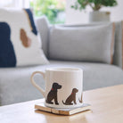 Sweet William Chocolate Cocker Spaniel Mug on a coffee table — illustrated Cocker Spaniel repeat pattern ceramic mug