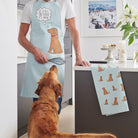 Organic cotton Fox Red Labrador apron and tea towel set, styled with Cooper from Sweet William Designs.