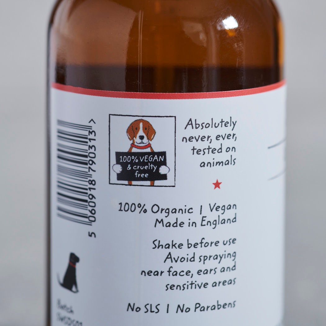Close-up of the Organic Sleepy Dog Spritz bottle label showing 100% vegan, organic, made in England and paraben-free details