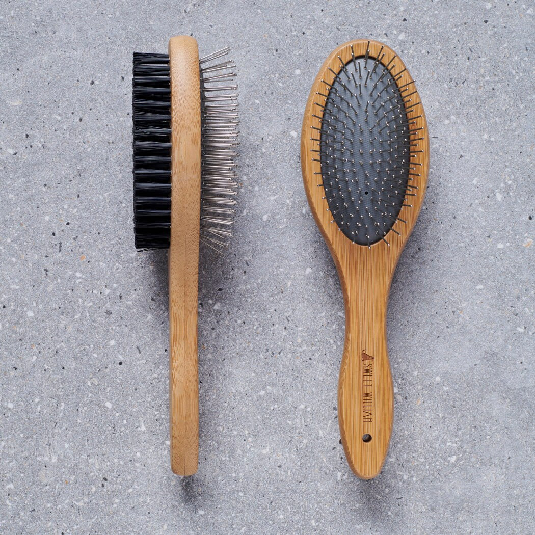Bamboo double sided dog brush on grey stone surface — dog grooming brush by Sweet William Designs