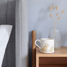 Sweet William Apricot Cockapoo Mug on a bedside table — Cockapoo dog lover gift mug