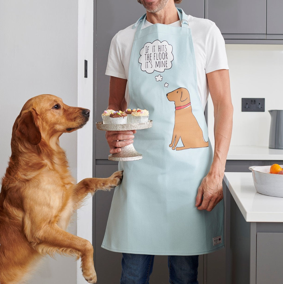 Fox Red Labrador apron featuring Cooper reaching for cake stand, with the playful design “If it hits the floor it’s mine” by Sweet William Designs