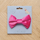 Pink velvet dog bow tie on its Sweet William backing card, a perfect little gift for a much-loved dog