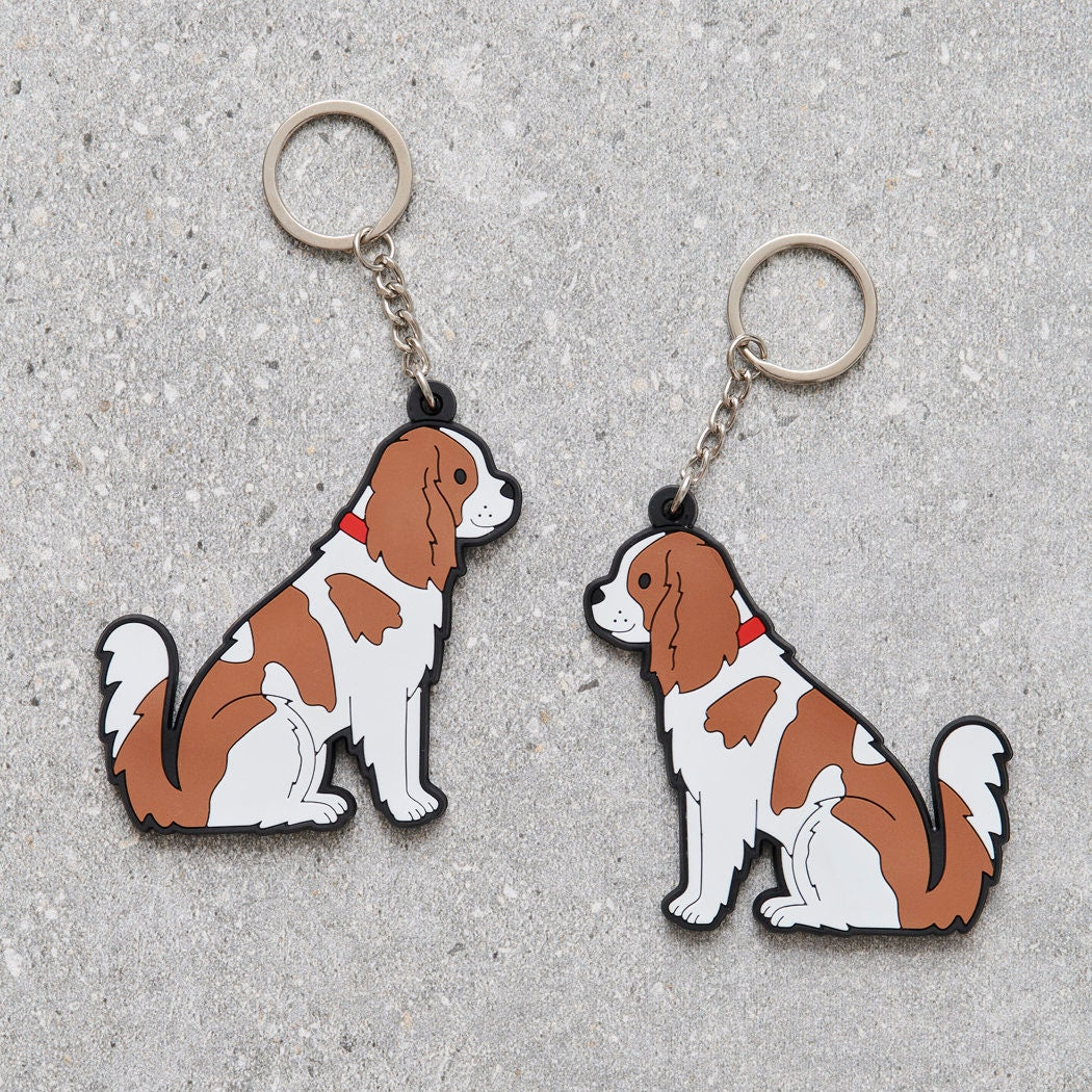 Cavalier King Charles Spaniel keyring showing both sides — double-sided PVC design with Sweet William's classic illustration
