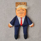 Donald Trump parody dog toy in navy suit with red tie and plush quiff — funny squeaky dog toy, political satire gift for dog lovers