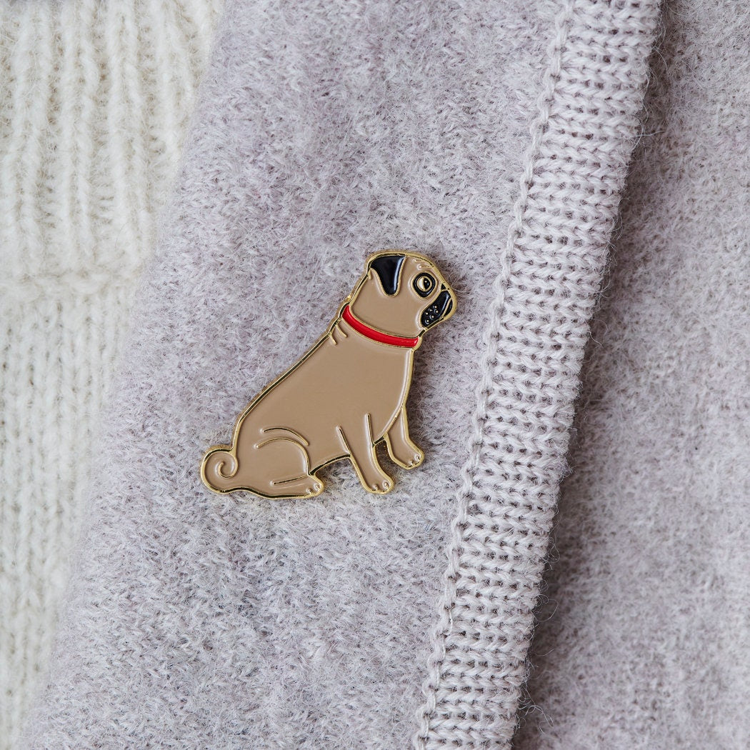 Close-up of Pug enamel pin attached to a wool jacket collar — gold-plated dog lover gift by Sweet William Designs