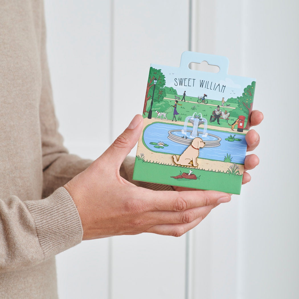 Apricot Cockapoo / Labradoodle enamel dog pin held in hands on illustrated park backing card — gold-plated dog lover gift by Sweet William Designs