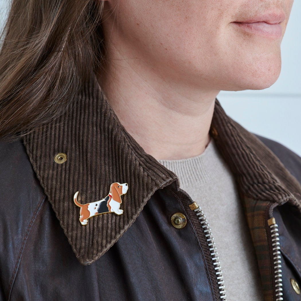 Basset Hound enamel pin worn on a corduroy jacket collar — gold-plated dog pin, perfect gift for dog lovers