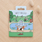Basset Hound enamel dog pin on Sweet William Designs park scene backing card — thoughtful gift for Basset Hound lovers