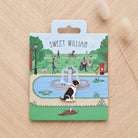 Black & White Springer Spaniel enamel dog pin on Sweet William Designs park scene backing card — thoughtful gift for Black & White Springer Spaniel lovers