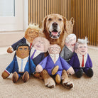 Golden Retriever surrounded by full range of political parody dog toys including Trump, Rishi, Boris and more — funny dog lover gifts