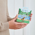 German Shepherd enamel dog pin held in hands on illustrated park backing card — gold-plated dog lover gift by Sweet William Designs