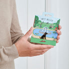 Black Cocker Spaniel enamel dog pin held in hands on illustrated park backing card — gold-plated dog lover gift by Sweet William Designs