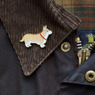 Close-up of Corgi enamel pin attached to a corduroy jacket collar — gold-plated dog pin by Sweet William Designs