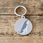 Close-up of Husky dog ID tag — silver-plated brass with illustrated Husky design, personalised dog tag by Sweet William Designs