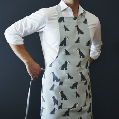 Grey Schnauzer apron in organic cotton canvas with screen-printed repeat Schnauzer illustration — a perfect gift for Schnauzer lovers by Sweet William Designs