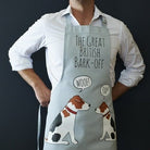 Jack Russell apron in organic cotton canvas with screen-printed “The Great British Bark-Off” design, featuring two Jack Russell dogs — a gift for Jack Russell lovers by Sweet William Designs