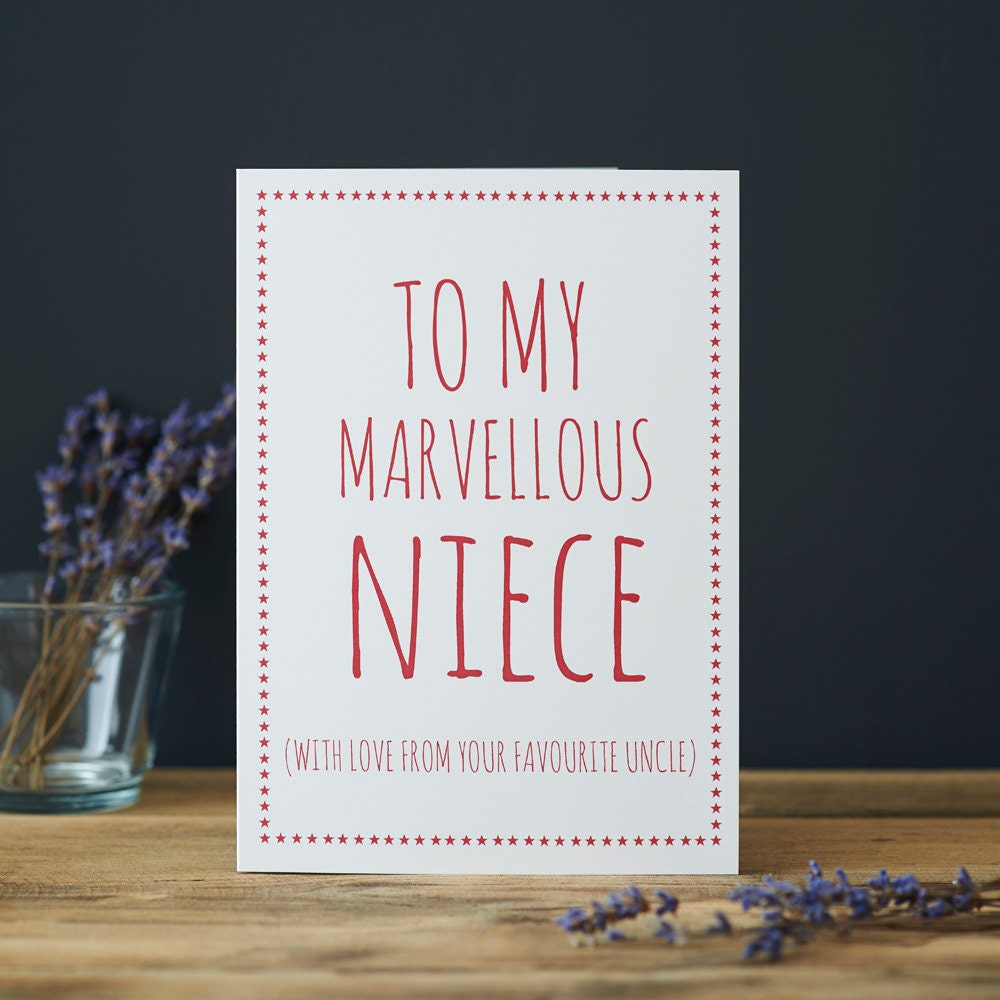 White Niece card with pink lettering reading “To My Marvellous Niece” and “With love from your favourite Uncle”, a pink star border and dried flowers beside it.