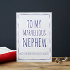 White Nephew card with blue lettering reading “To My Marvellous Nephew” and “With love from your favourite Auntie”, a blue star border and silver cufflinks beside it.