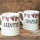 Ceramic Auntie and Uncle mugs with Union Jack bunting, photographed together on a rustic wooden surface, lovely family gift by Sweet William Designs